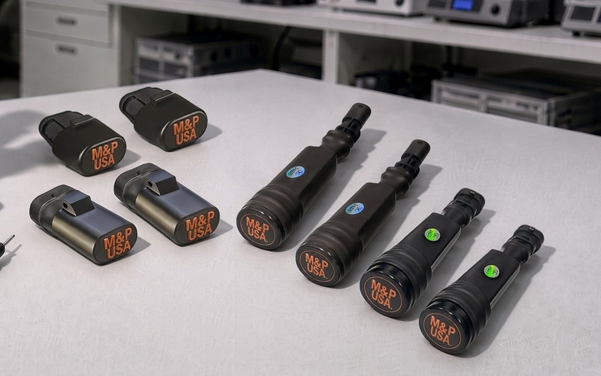 M&P USA ride height and shock simulators laid out on a quality control bench